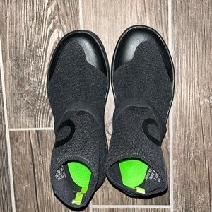 Brand new. Oofos slide ons size 9